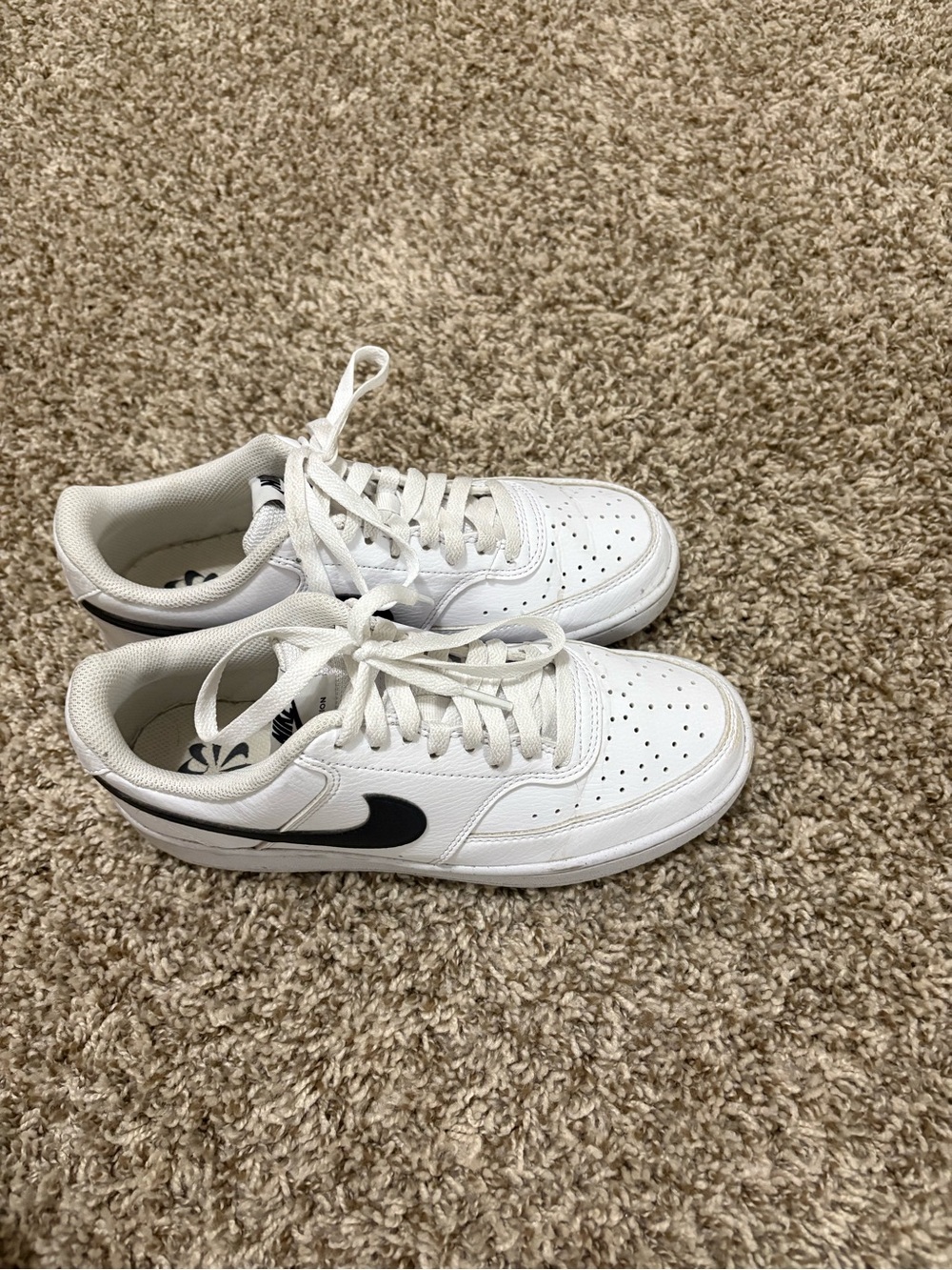 Nike White Low-Top Sneakers with Black Swoosh
